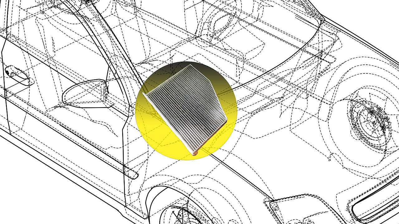 Filtro del habitáculo sobre fondo amarillo en el compartimento del motor de un turismo transparente